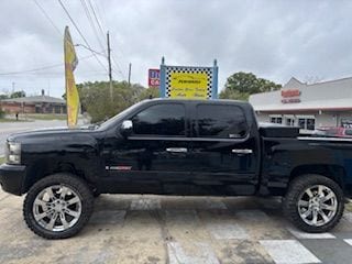 Black Chevrolet pickup with matched window tint