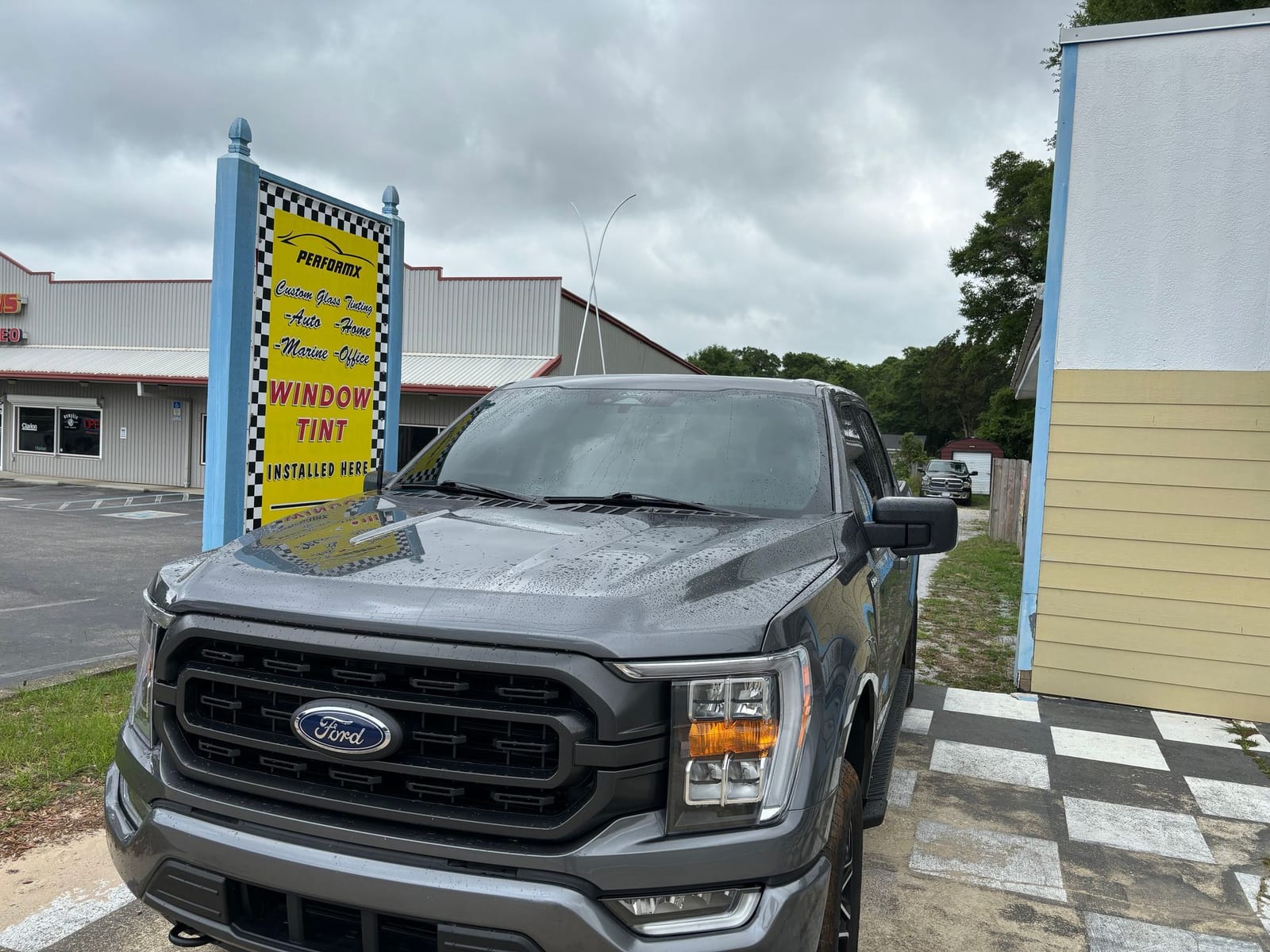 Perform X shop sign and a completed truck tint project